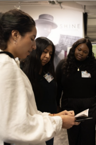 Three people looking at a document